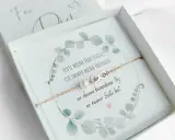 Ein Armband mit Unendlichkeitszeichen und Perle, verpackt mit einem **Trauzeugin Text**: "Heute meine Trauzeugin, für immer meine Freundin. An diesem besonderen Tag an meiner Seite bist.