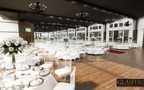 Elegante Glashaus Hochzeitslocation mit vielen weiß gedeckten Tischen, weißen Stühlen und üppigen Blumenarrangements.