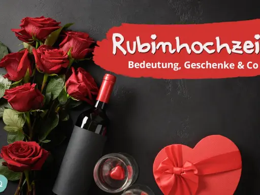 Rote Rosen, Wein und eine Herzschachtel symbolisieren die Rubinhochzeit Bedeutung. Ein Fest der Liebe nach 40 Jahren Ehe.